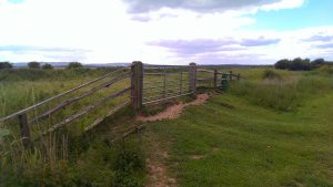 Entirely unmarked, padlocked gate